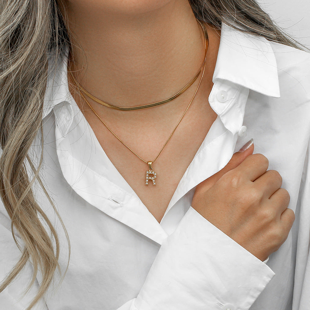 Collier initiale double chaîne doré
